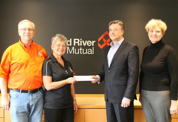 Kim Batchelor of Red River Mutual and Rob Depres, CEO of BSI Insurance Brokers presenting the cheque to Guy Mullen and Rita Wiebe of the Altona Elks.