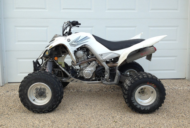 White 2006 Yamaha Raptor stolen from a garage in Mitchell, MB.